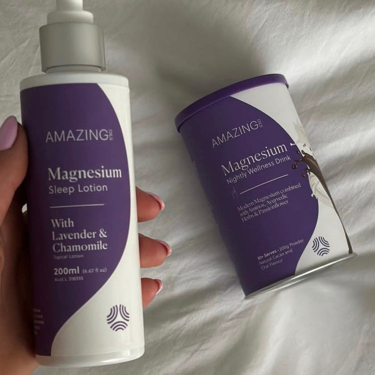 Lotion bottle and container with 'Amazing' branding on a white fabric background