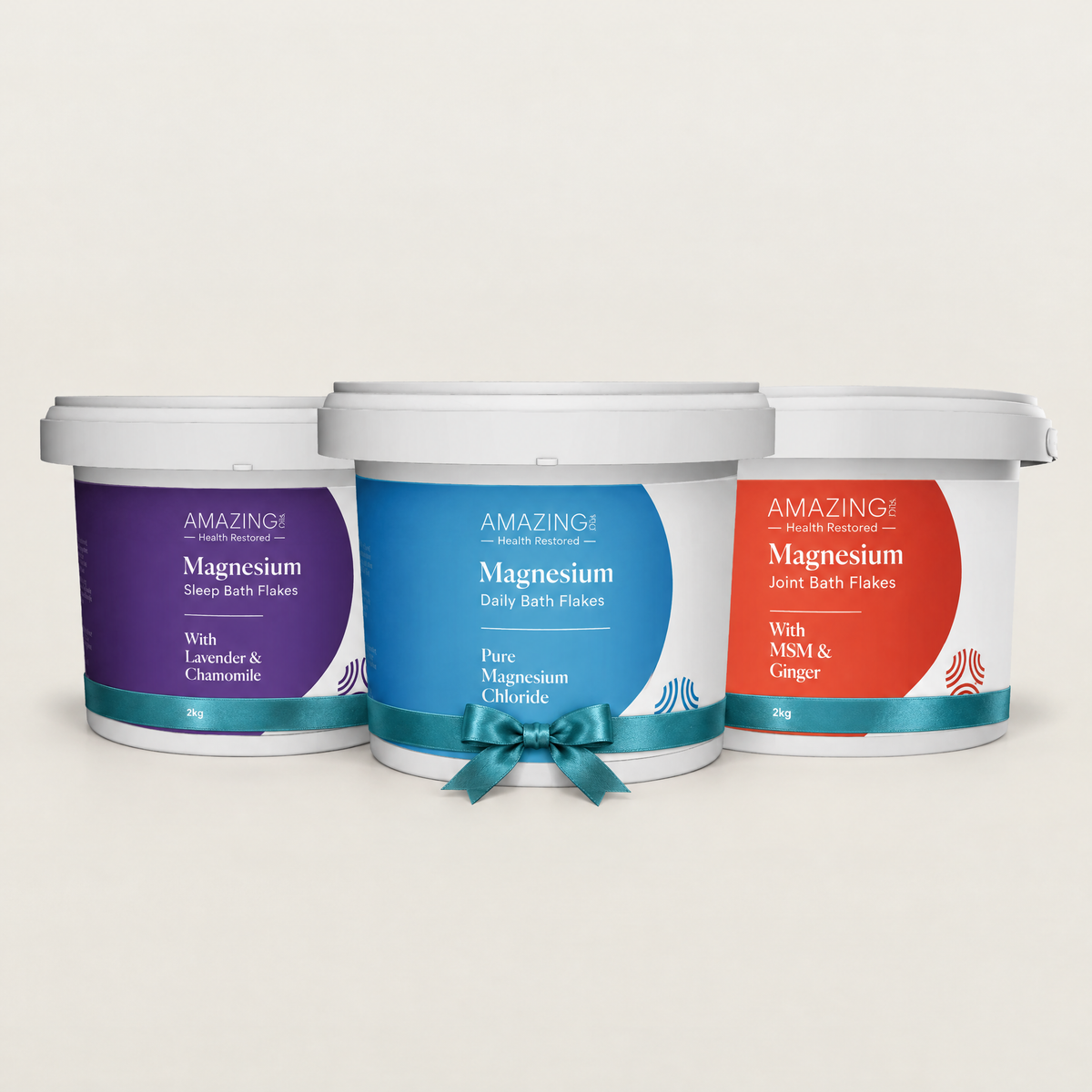 Bath Discovery Trio 3 x 2kg: Sleep, Daily and Joint Magnesium Flakes buckets tied with a teal ribbon