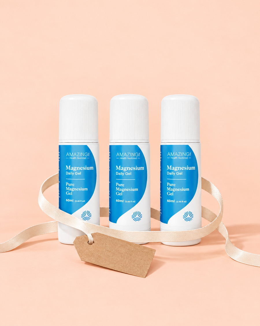 Three Daily Magnesium Gel roll-ons tied together with a ribbon